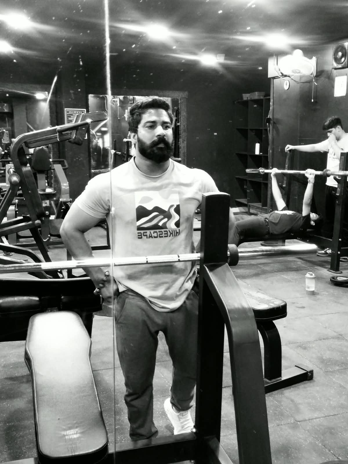 Sanjay Purbia beside strength equipment